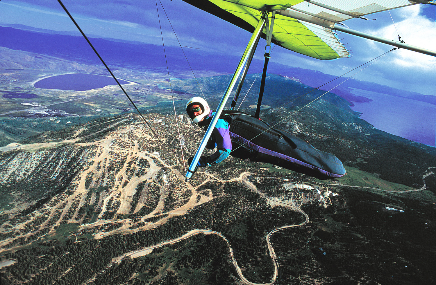 Paul Hamilton soaring hang glider in front of Slide Mountain, NV