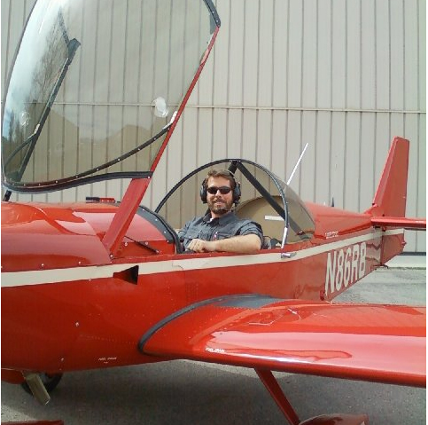 Ray sitting in a plane, ready to take off!